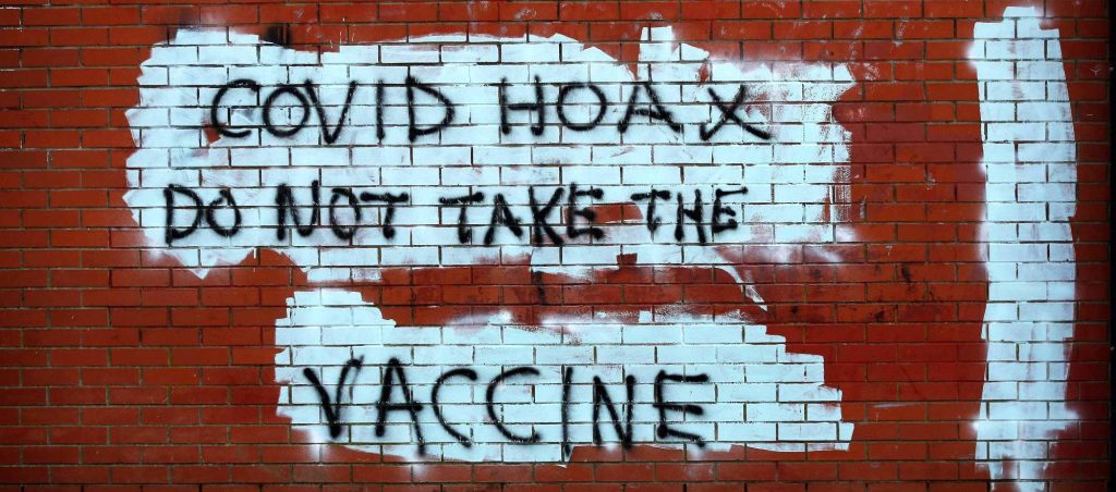 Anti-vaccine graffiti is seen on the wall of a shop amid the outbreak of the coronavirus disease (COVID-19) in Belfast, Northern Ireland January 1, 2021. REUTERS/Phil Noble