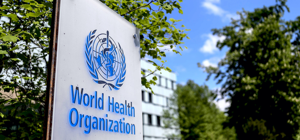 This picture taken on April 24, 2020 shows a sign of the World Health Organization (WHO) in Geneva next to their headquarters, amid the COVID-19 outbreak, caused by the novel coronavirus. (Photo by Fabrice COFFRINI / AFP) (Photo by FABRICE COFFRINI/AFP via Getty Images)