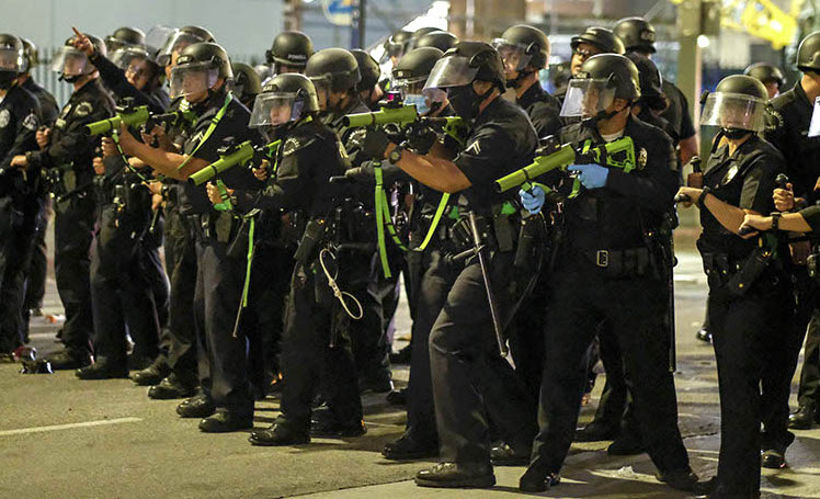 Police officers prepare to fire rubber bullets during a protest over the death of George Floyd, Friday, May 29, 2020 in Los Angeles. Floyd died in police custody Monday in Minneapolis. (AP Photo/Ringo H.W. Chiu)